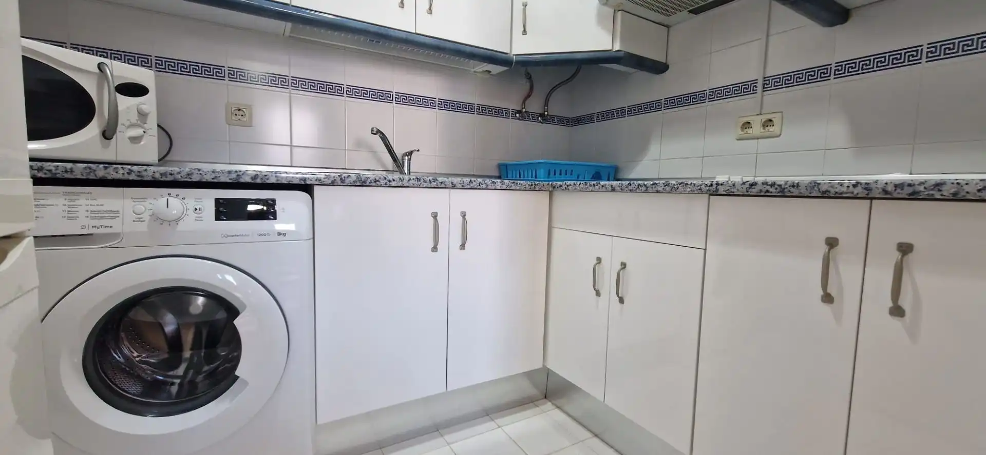 Cuina de Apartament de lloguer en El Portil amb Piscina comunitària