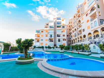 Swimming pool of Flat for sale in Torrevieja  with Air Conditioner, Heating and Terrace