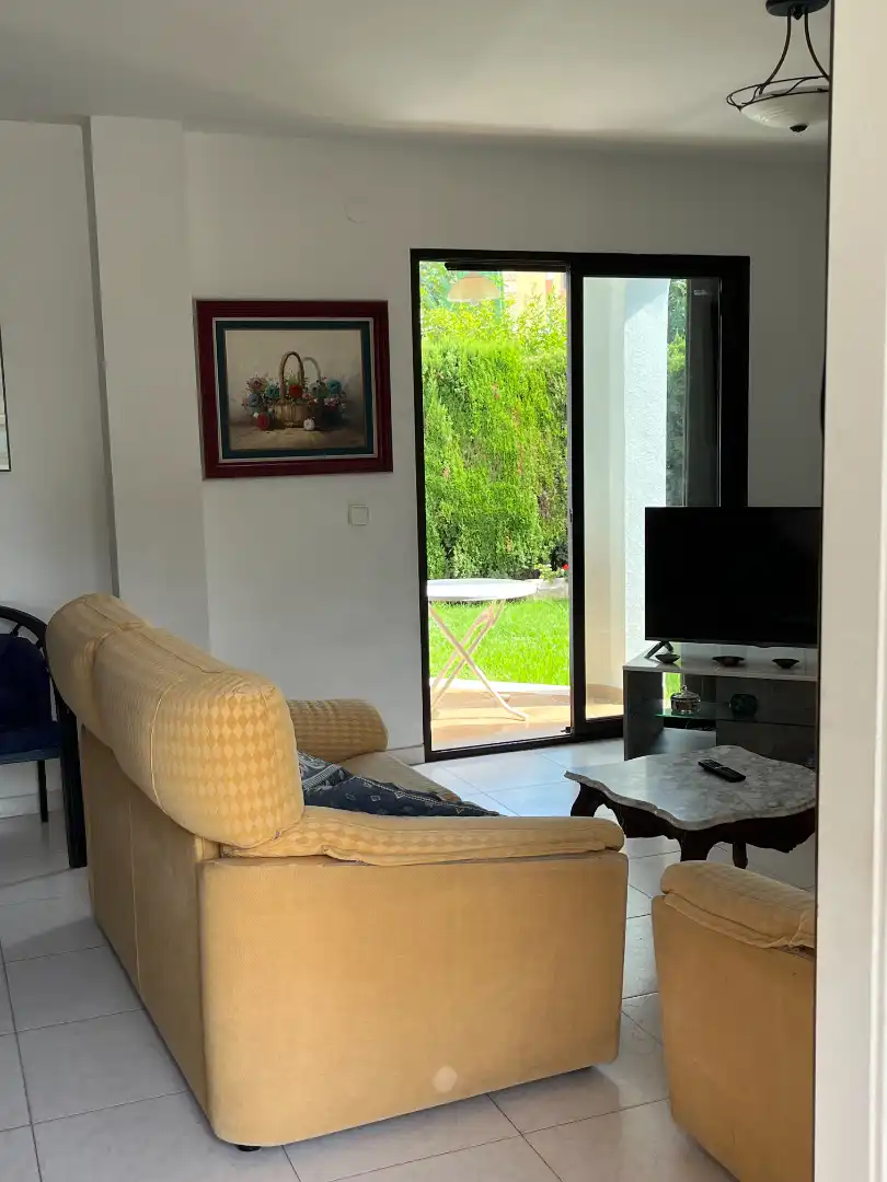 Sala d'estar de Casa o xalet en venda en Sueca amb Jardí privat, Terrassa i Moblat