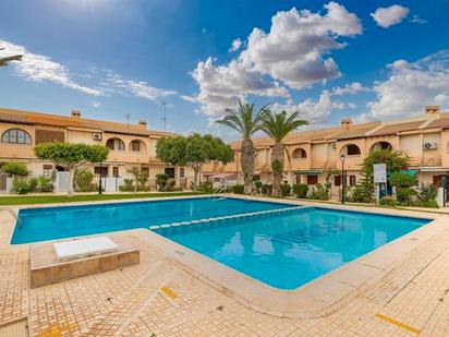 Swimming pool of Single-family semi-detached for sale in Torrevieja  with Air Conditioner, Heating and Terrace