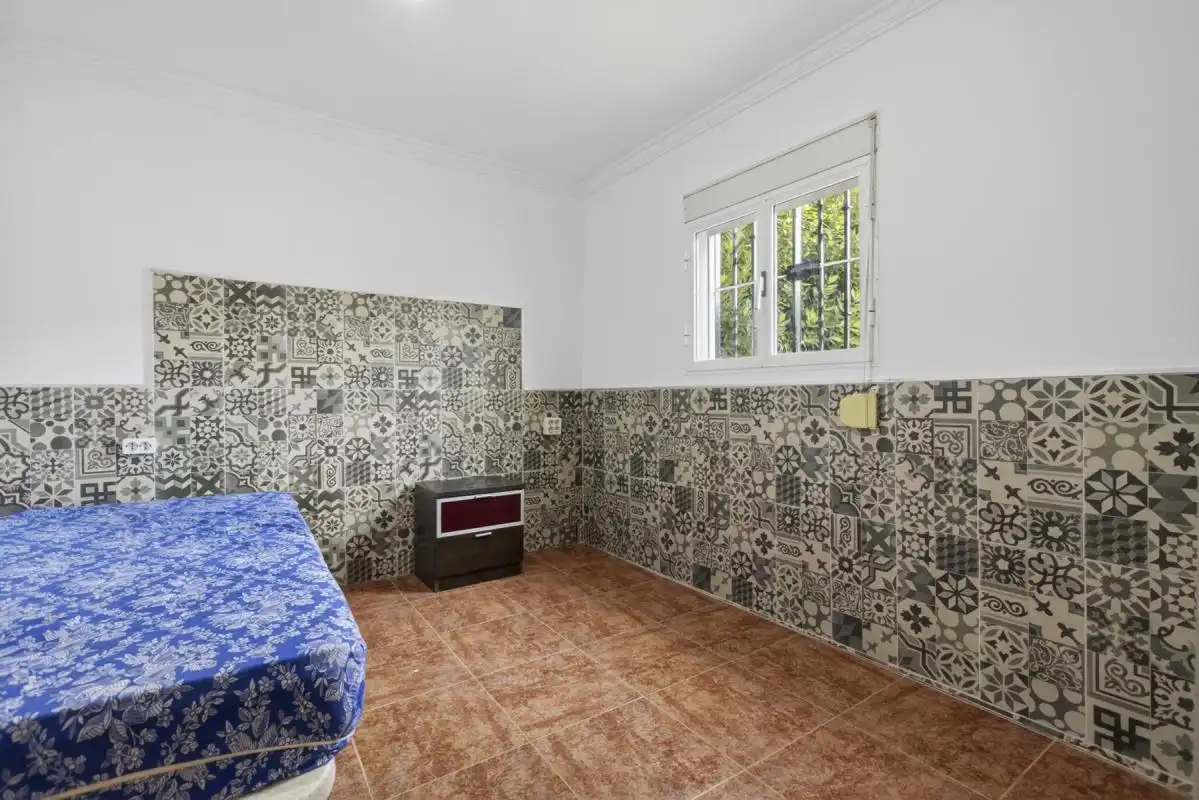 Habitación de Finca rústica en venta en La Rinconada con Calefacción, Jardín privado y Terraza
