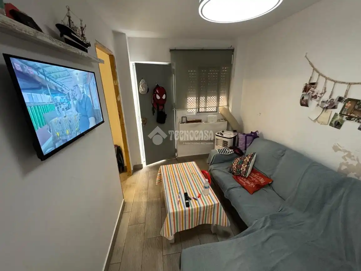 Sala d'estar de Casa adosada en venda en La Rinconada amb Aire condicionat i Calefacció