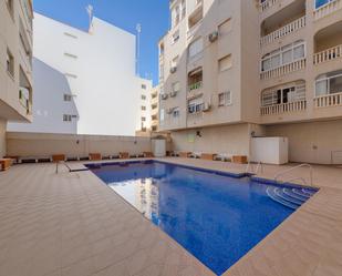 Swimming pool of Apartment for sale in Torrevieja  with Air Conditioner, Terrace and Community pool