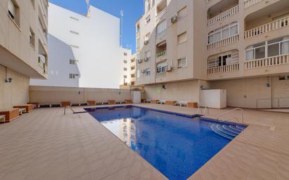 Swimming pool of Apartment for sale in Torrevieja  with Air Conditioner, Terrace and Community pool