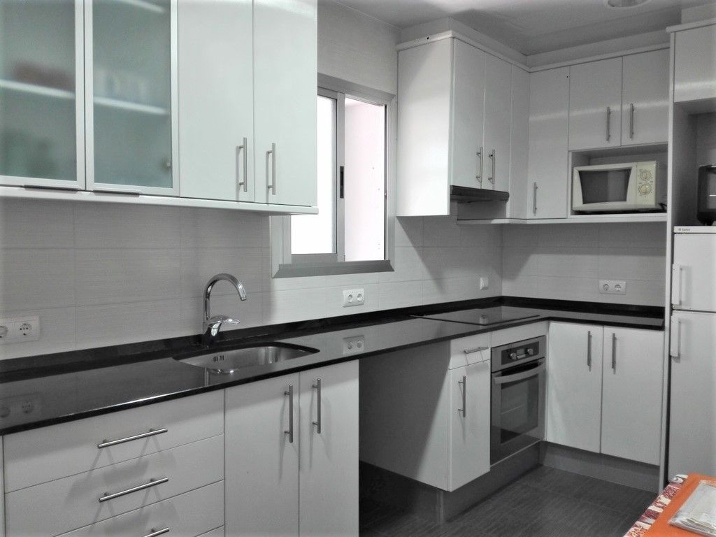 Kitchen of Flat for sale in Cunit  with Air Conditioner, Terrace and Storage room