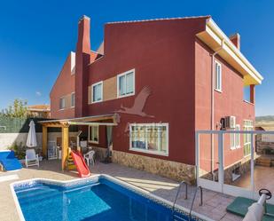 Exterior view of Single-family semi-detached for sale in Torres de la Alameda  with Air Conditioner, Terrace and Swimming Pool