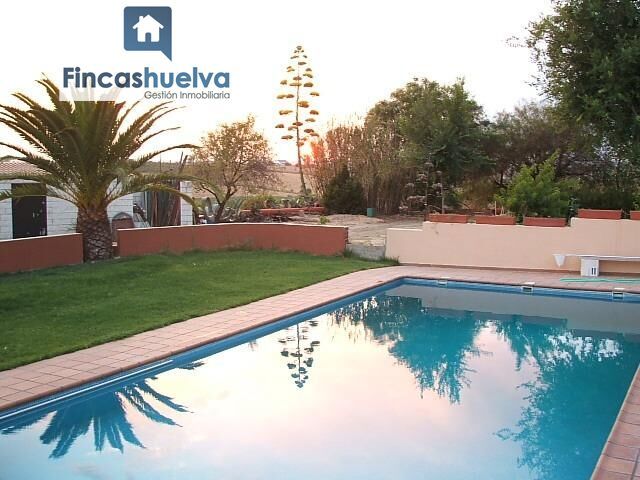 Swimming pool of Country house for sale in Moguer  with Air Conditioner, Heating and Storage room