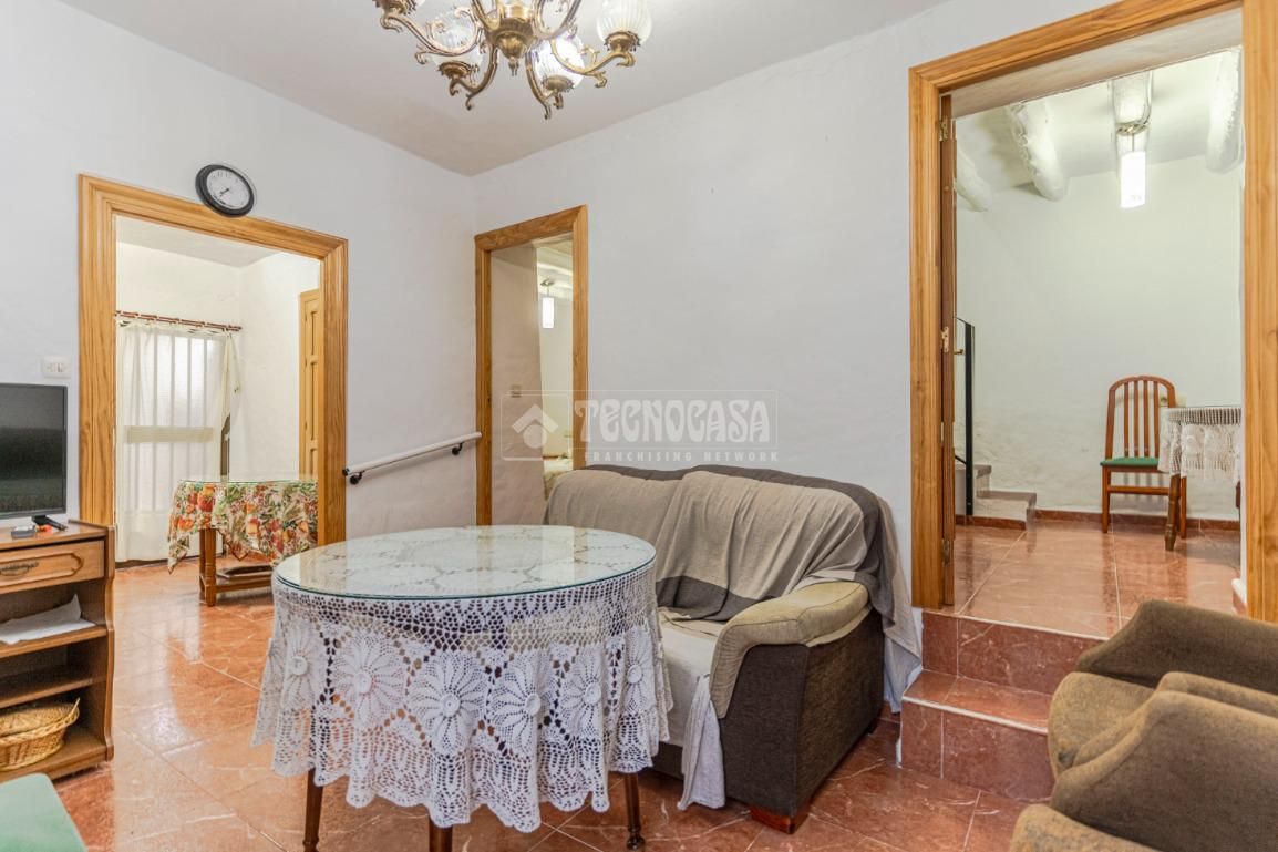 Sala d'estar de Casa adosada en venda en Molvízar amb Jardí privat i Terrassa
