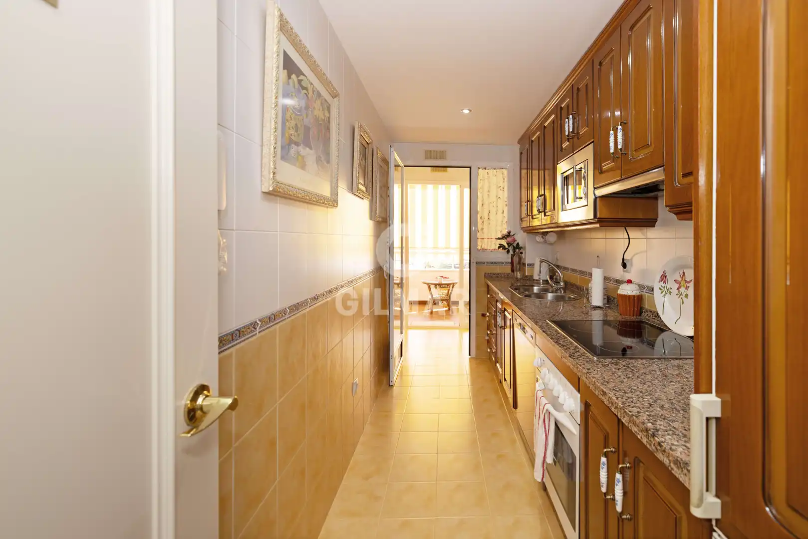 Küche von Wohnung zum Verkauf in Benalmádena mit Privatgarten, Schwimmbad und Möbliert