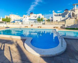 Swimming pool of Single-family semi-detached for sale in Torrevieja  with Air Conditioner, Terrace and Storage room