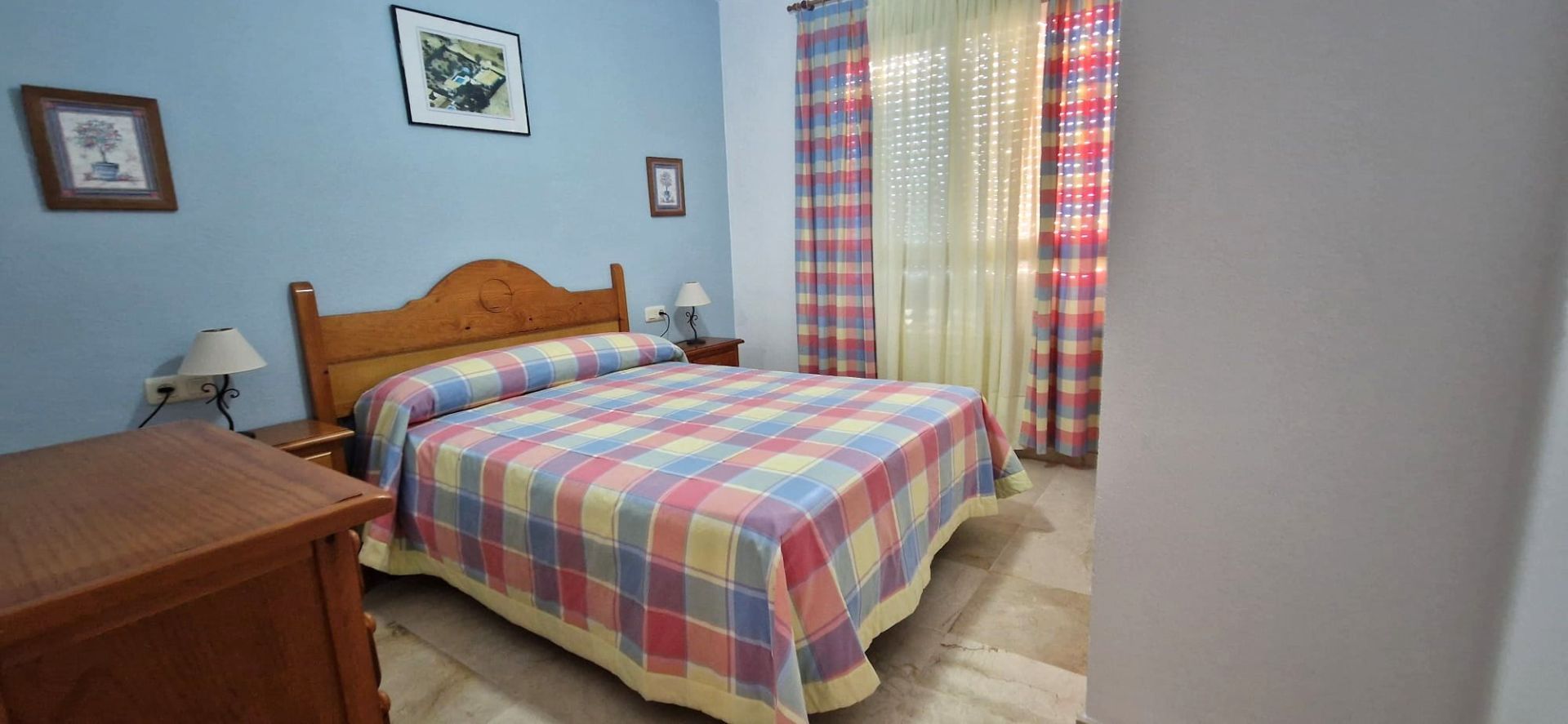 Dormitori de Apartament de lloguer en El Portil amb Piscina comunitària