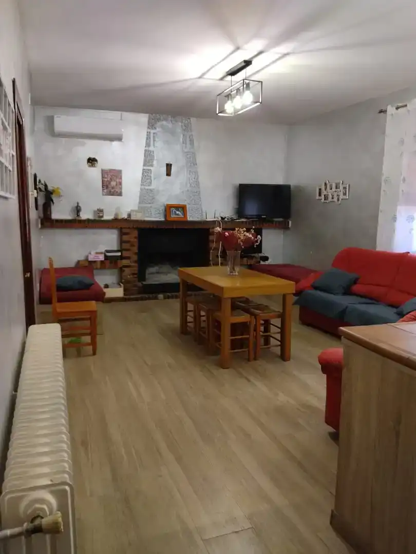Sala d'estar de Casa o xalet en venda en Membrilla amb Aire condicionat, Jardí privat i Parquet