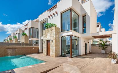 Vista exterior de Casa adosada en venda en Rojales amb Jardí privat, Terrassa i Piscina