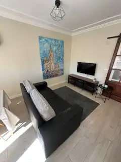 Sala d'estar de Apartament en venda en León Capital  amb Calefacció, Parquet i Terrassa