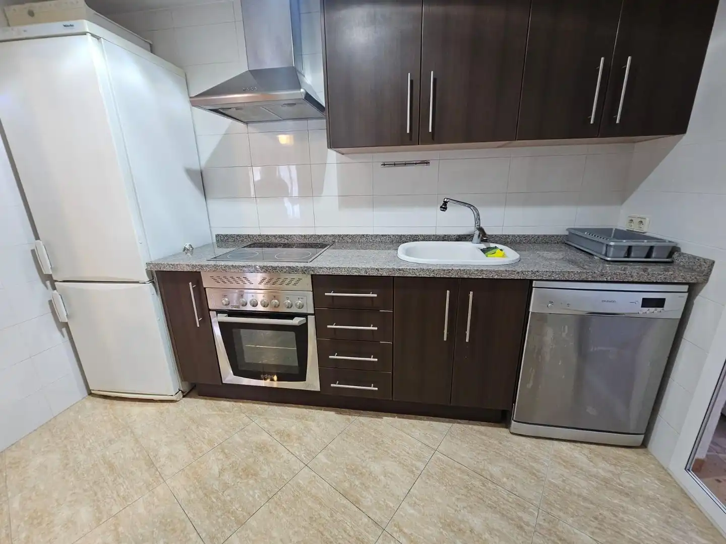 Kitchen of Flat for sale in Simat de la Valldigna  with Air Conditioner, Private garden and Balcony