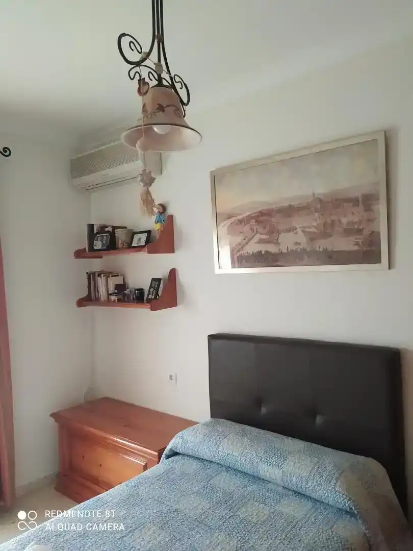 Sala d'estar de Casa adosada en venda en Marchena amb Aire condicionat i Traster