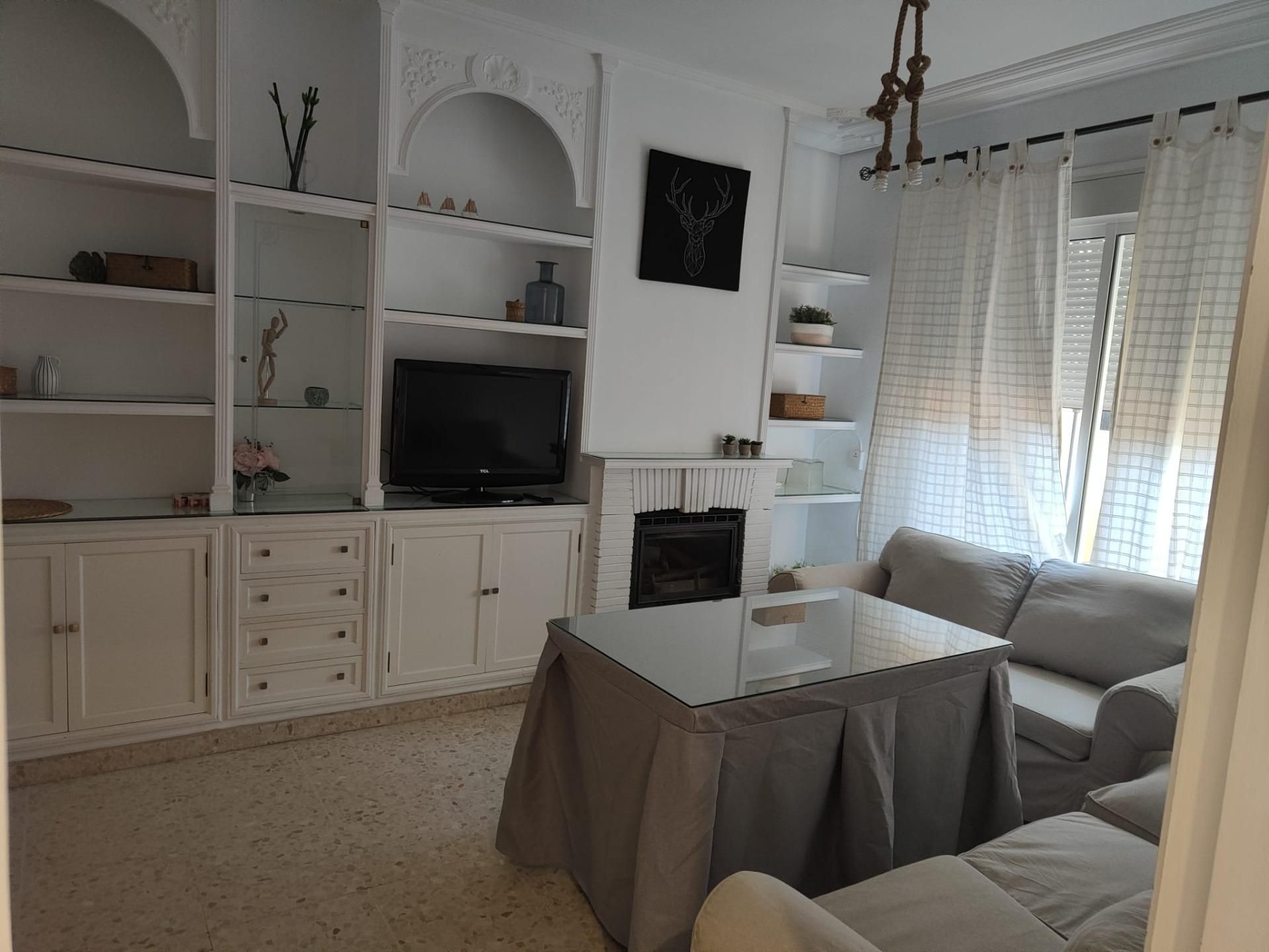 Sala d'estar de Casa adosada de lloguer en  Sevilla Capital amb Aire condicionat