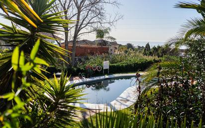 Swimming pool of Single-family semi-detached for sale in Benalmádena  with Air Conditioner, Heating and Private garden