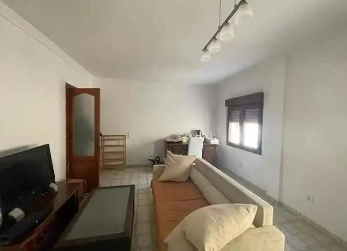 Sala d'estar de Casa adosada en venda en Calpe / Calp amb Aire condicionat, Jardí privat i Terrassa