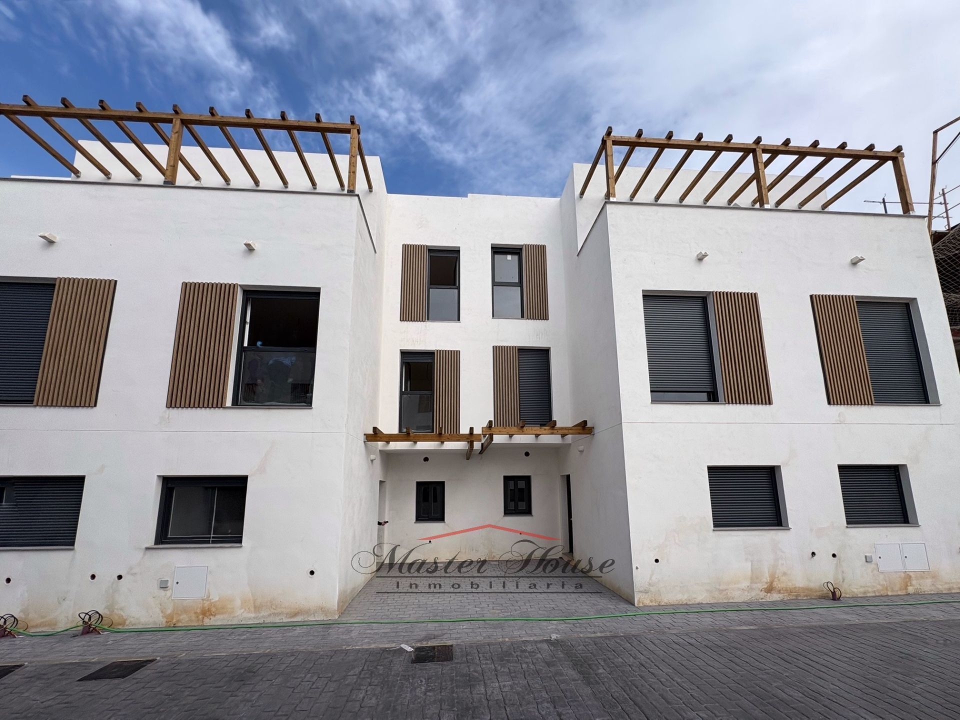 Vista exterior de Casa adosada en venta en Aljaraque con Calefacción, Jardín privado y Terraza