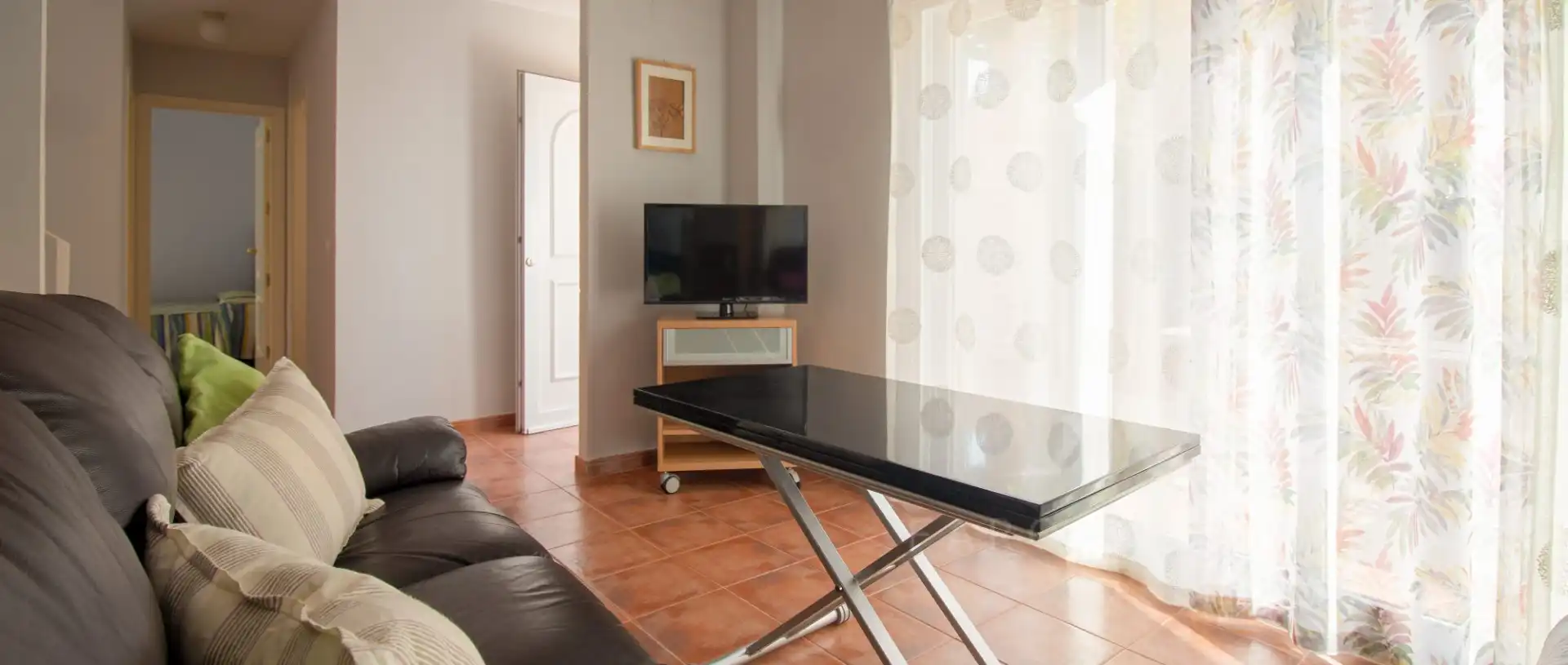 Sala de estar de Casa adosada en venta en Rota con Aire acondicionado, Terraza y Piscina comunitaria
