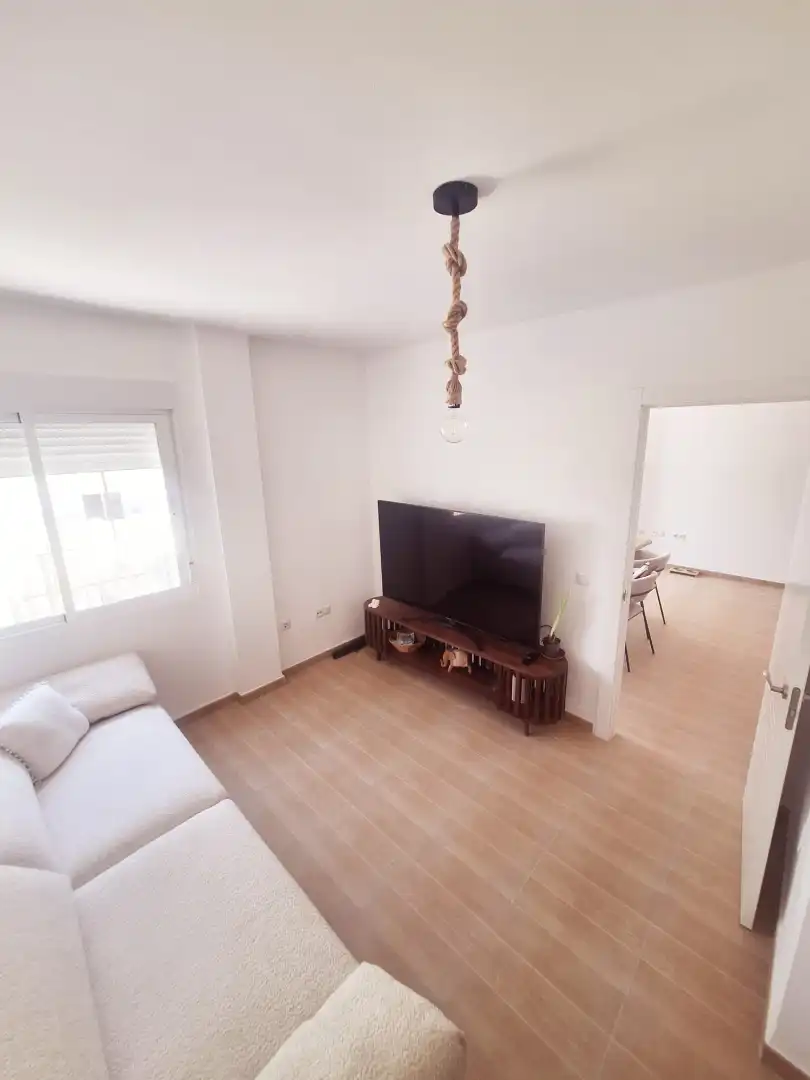 Wohnzimmer von Wohnung zum Verkauf in Balanegra mit Klimaanlage, Abstellraum und Gemeinschaftspool