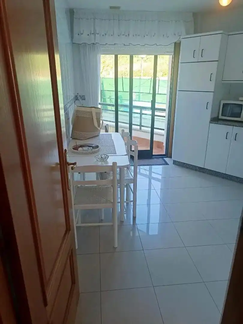 Cuina de Apartament en venda en Sanxenxo amb Terrassa, Traster i Piscina