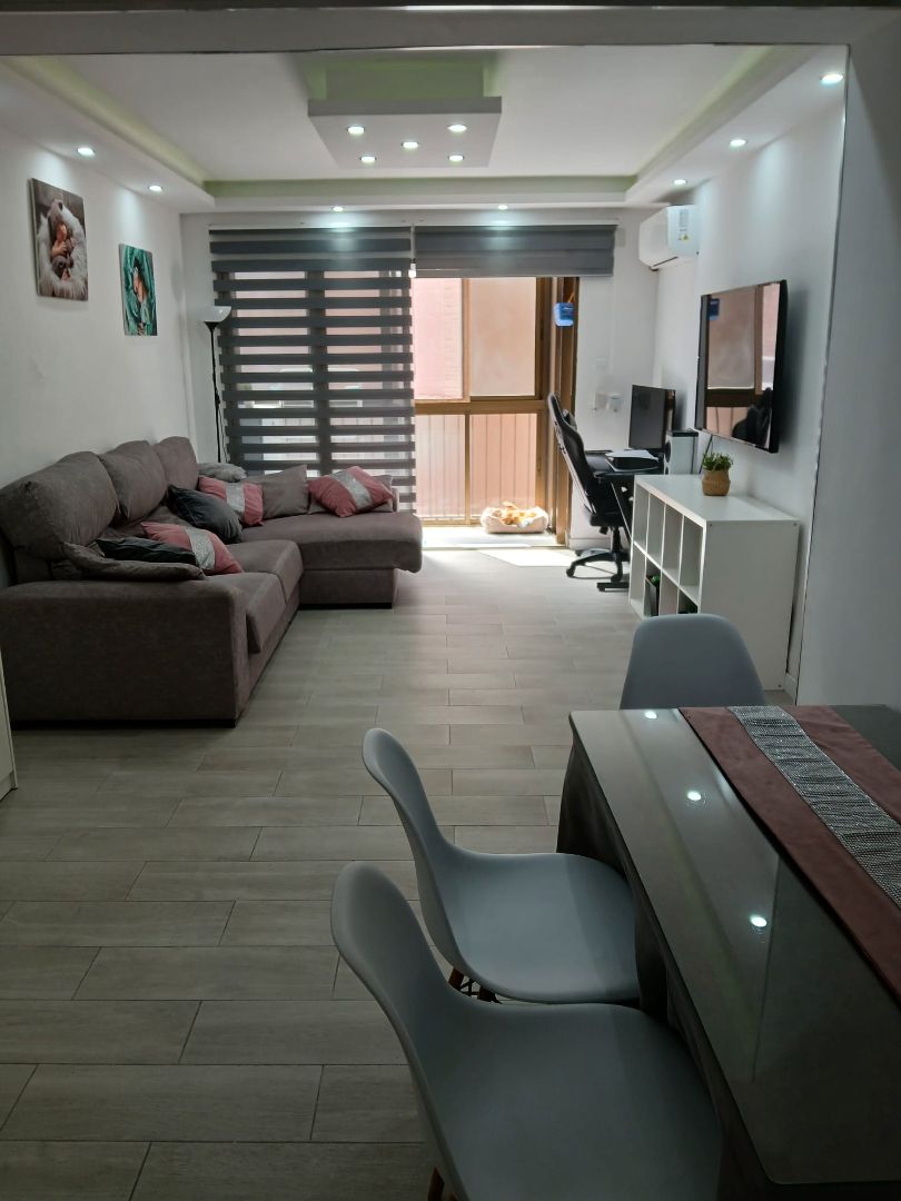 Living room of Flat for sale in Motril  with Air Conditioner, Furnished and Oven