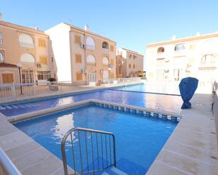 Swimming pool of Apartment for sale in Torrevieja  with Air Conditioner, Heating and Terrace