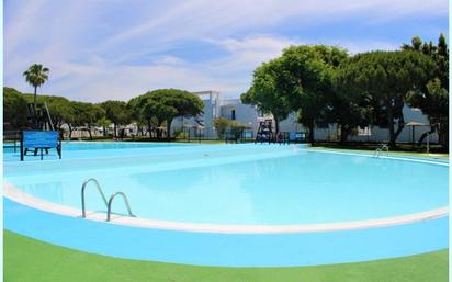 Piscina de Dúplex de lloguer en Chiclana de la Frontera amb Jardí privat, Terrassa i Piscina comunitària