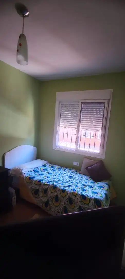 Habitación de Casa adosada en venta en Coria del Río con Trastero, Amueblado y Piscina comunitaria
