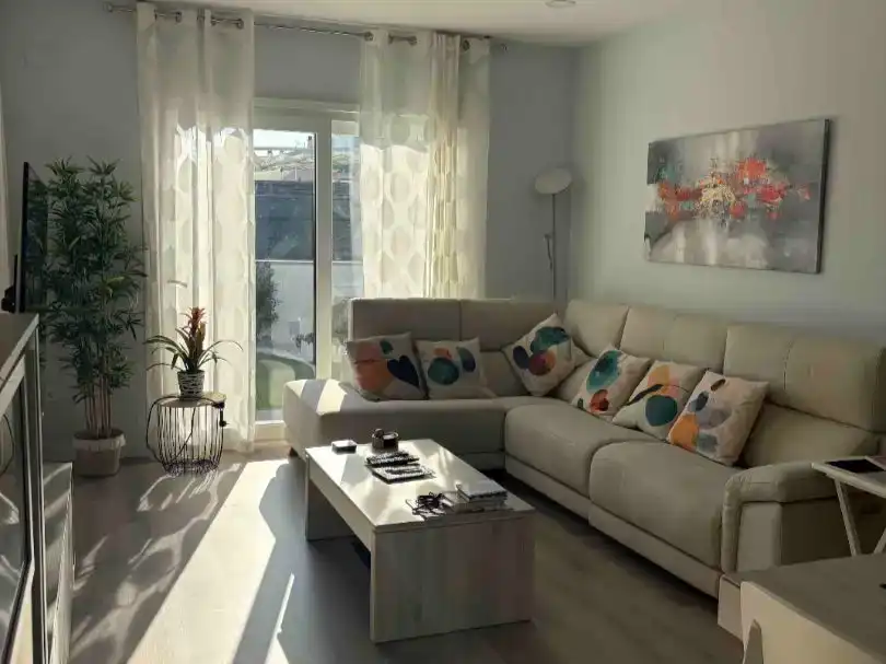 Living room of Flat for sale in Cunit  with Air Conditioner, Private garden and Parquet flooring
