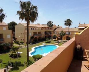 Jardí de Apartament de lloguer en Chiclana de la Frontera amb Terrassa, Balcó i Piscina comunitària