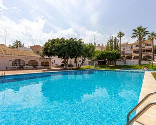 Piscina de Casa adosada de lloguer en El Campello amb Aire condicionat i Terrassa