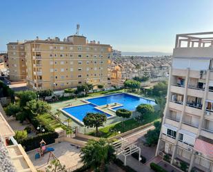 Swimming pool of Flat for sale in Torrevieja  with Air Conditioner, Heating and Terrace