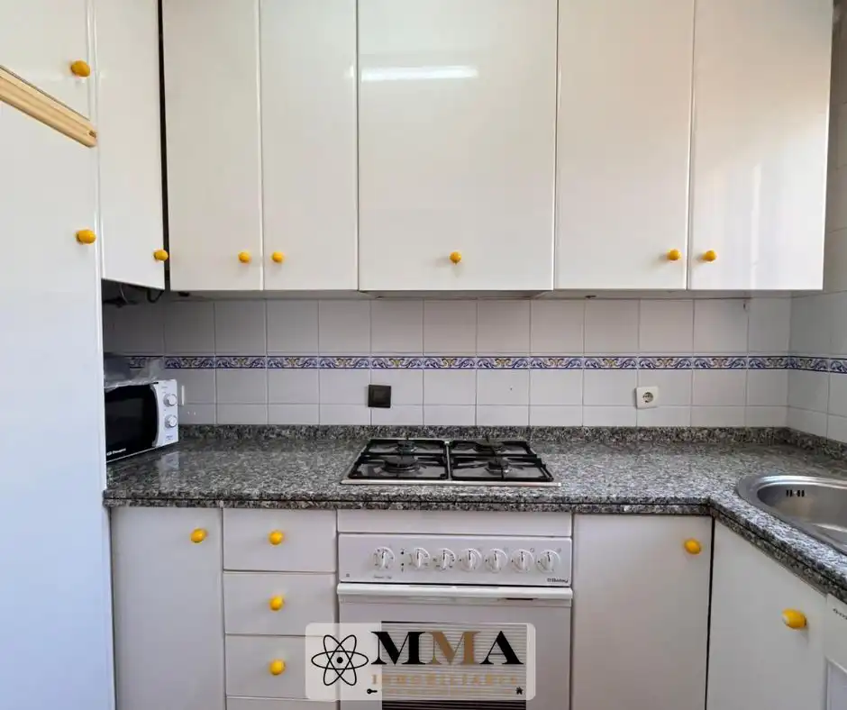 Cuina de Casa adosada en venda en El Portil amb Aire condicionat, Calefacció i Jardí privat