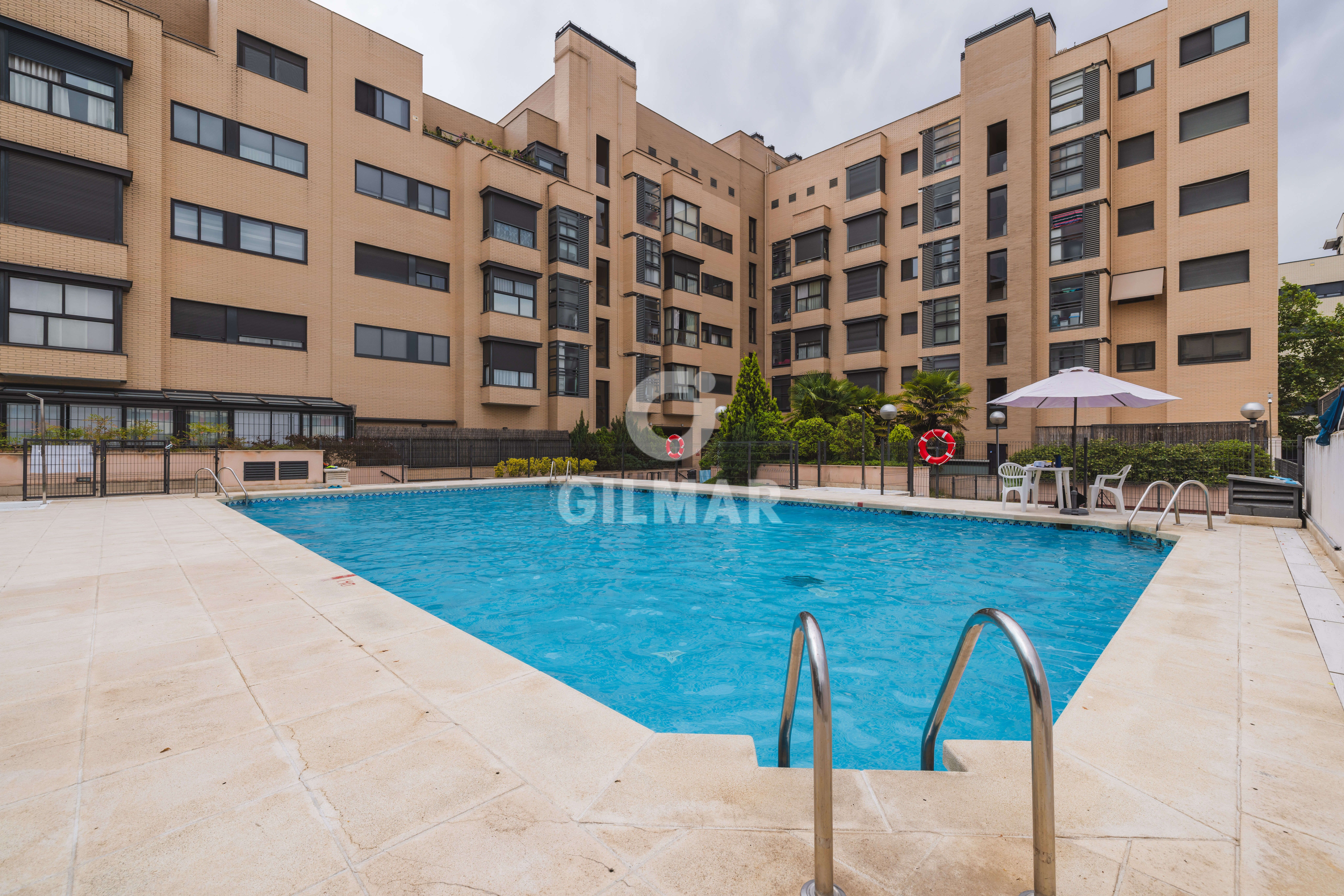Swimming pool of Flat for sale in  Madrid Capital  with Heating, Private garden and Storage room