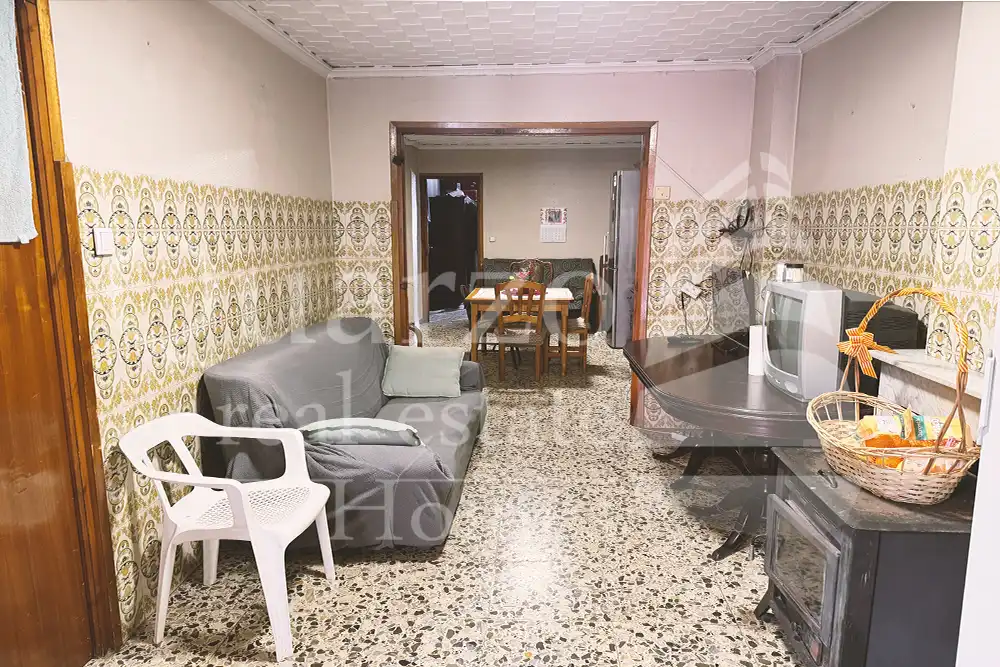 Sala d'estar de Casa adosada en venda en Real amb Traster i Moblat