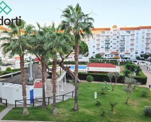 Vista exterior de Pis en venda en El Portil amb Jardí privat, Terrassa i Piscina comunitària