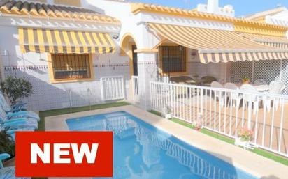 Exterior view of Single-family semi-detached for sale in Pilar de la Horadada  with Air Conditioner, Private garden and Storage room