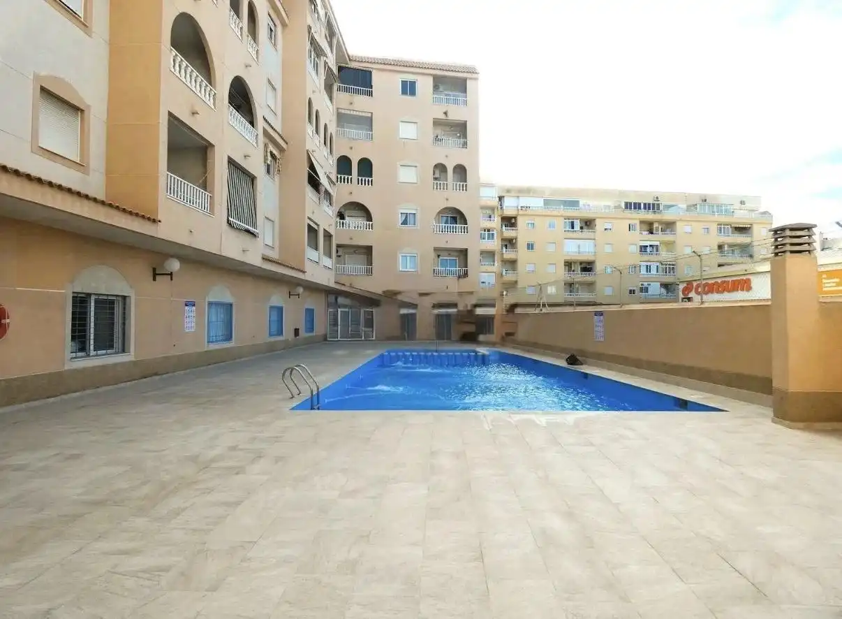 Swimming pool of Ground floor for sale in Torrevieja  with Air Conditioner, Terrace and Community pool