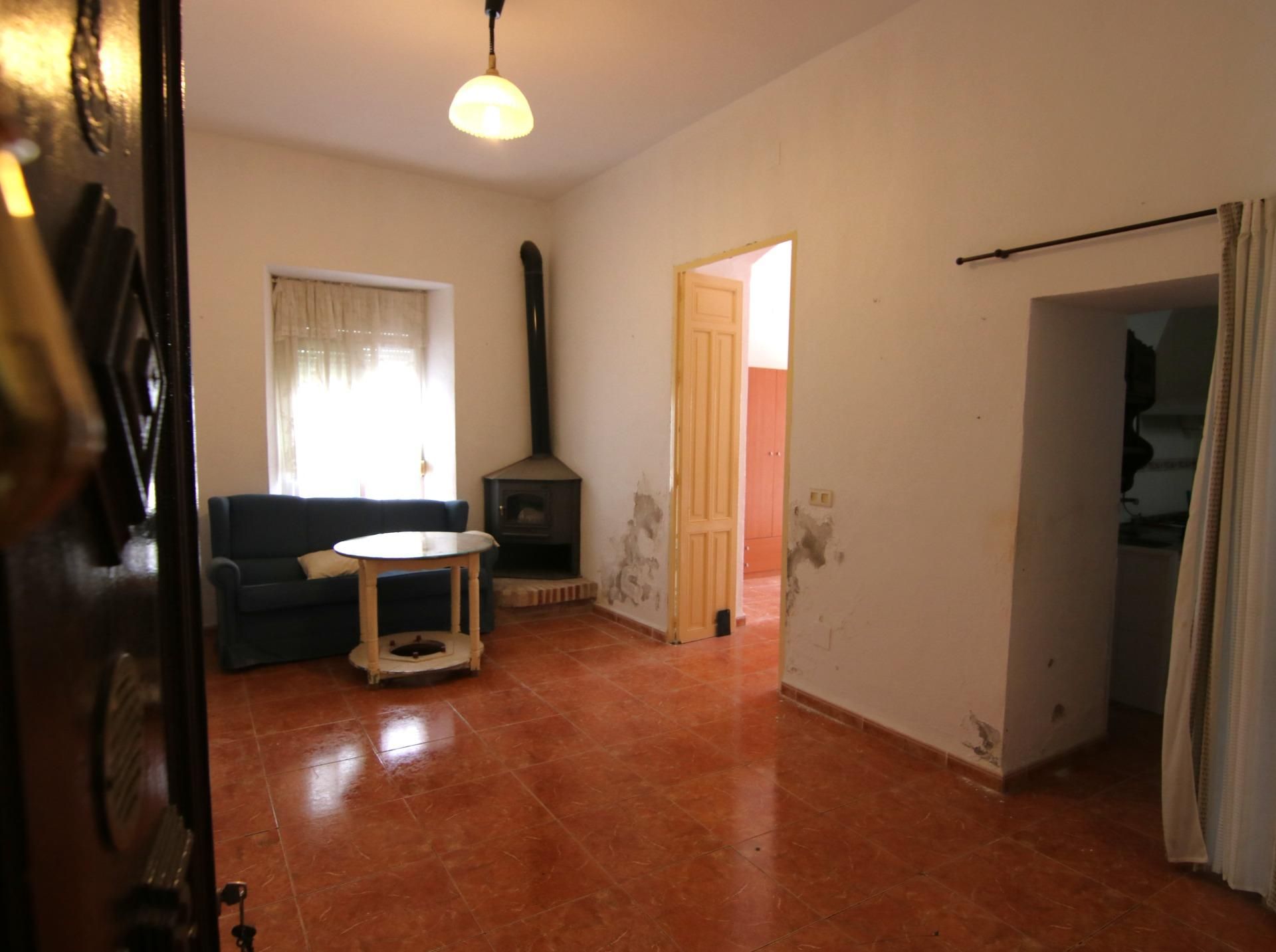 Sala d'estar de Casa o xalet en venda en Alozaina amb Jardí privat