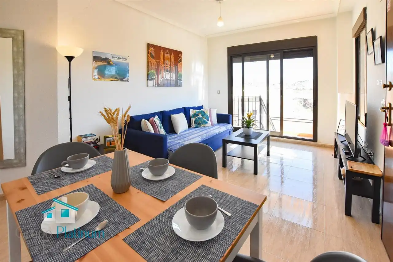 Sala d'estar de Apartament en venda en Pulpí amb Aire condicionat, Piscina i Moblat