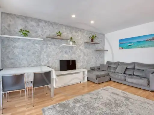Sala de estar de Piso en venta en Castell d'Aro, Platja d'Aro i s'Agaró con Aire acondicionado, Calefacción y Amueblado