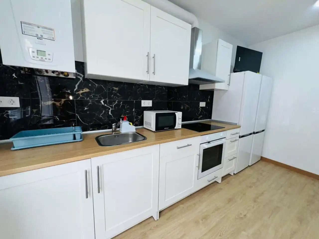 Kitchen of Flat for share in Ourense Capital   with Heating, Furnished and Balcony