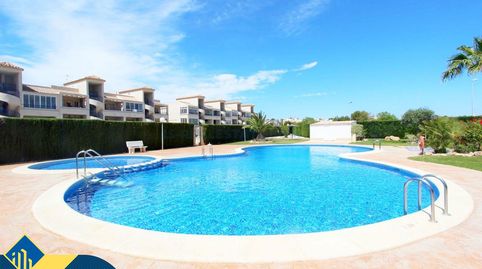 Apartamento con piscina comunitaria, en la provincia de Alicante, en la localidad de Orihuela Costa. 2 habitaciones | 72 m² | A 2,
