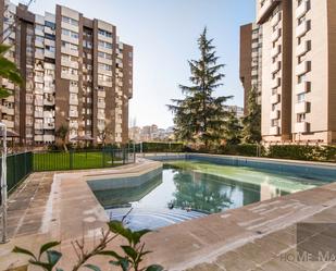Swimming pool of Flat for sale in  Madrid Capital  with Heating, Private garden and Parquet flooring