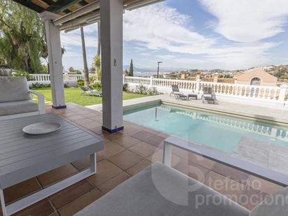 Exterior view of House or chalet for sale in Málaga Capital  with Air Conditioner, Terrace and Swimming Pool