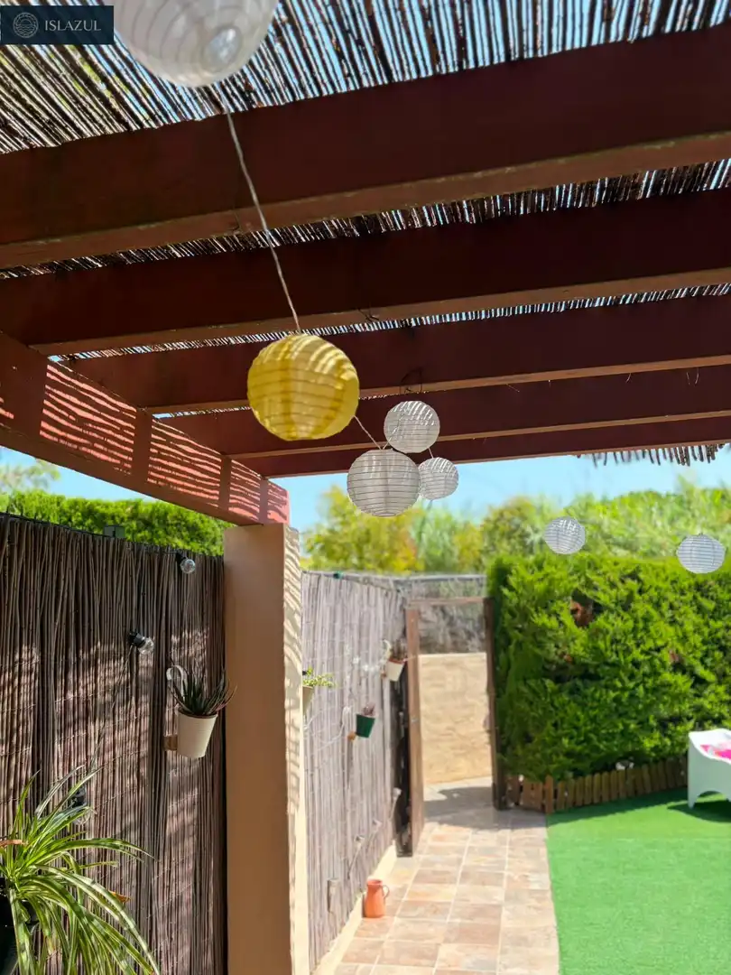 Garten von Einfamilien-Reihenhaus zum Verkauf in Islantilla mit Privatgarten, Terrasse und Abstellraum