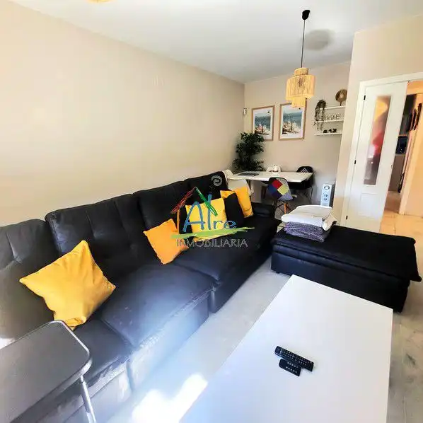 Sala de estar de Casa adosada en venta en Almonte con Aire acondicionado, Calefacción y Jardín privado